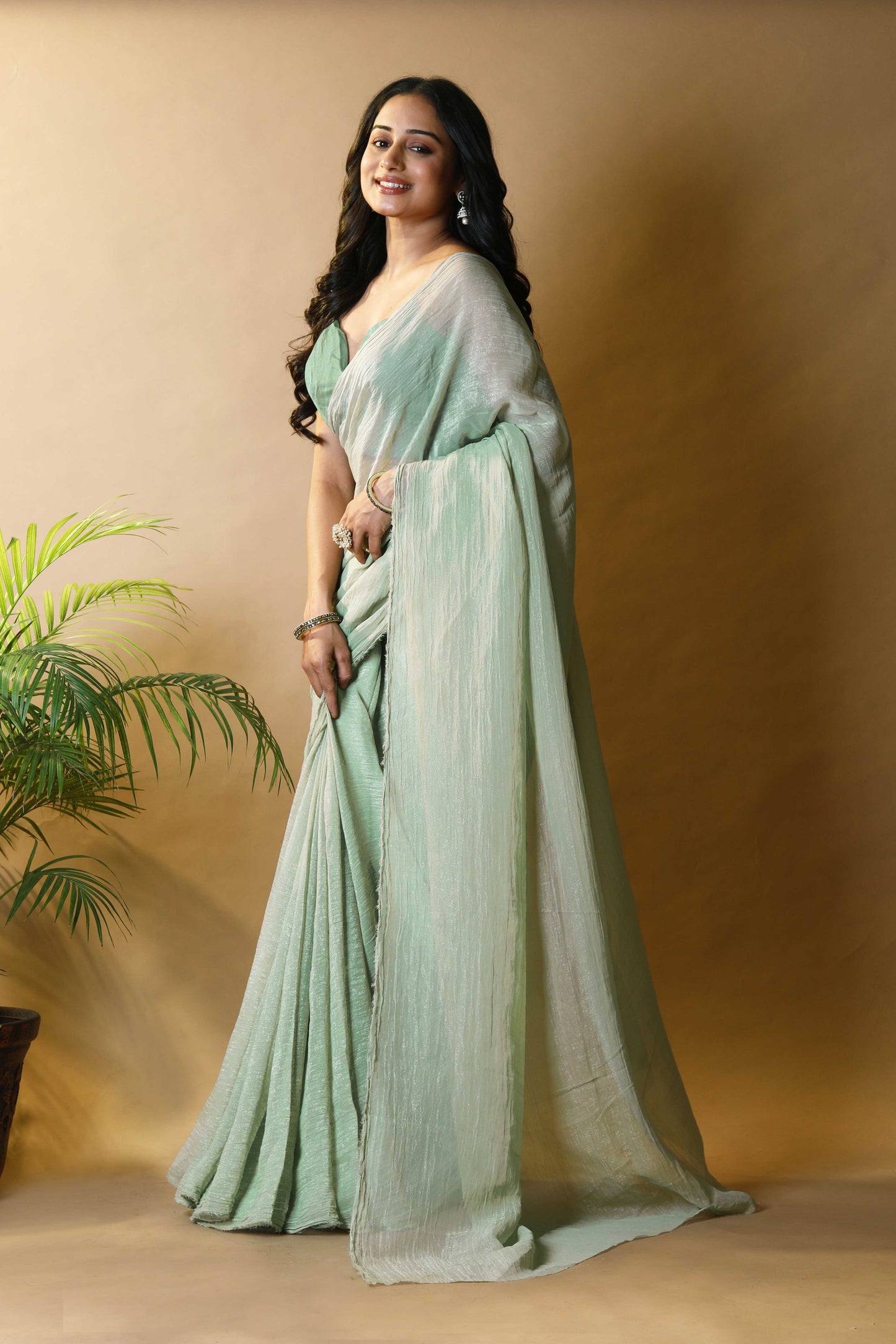 Elegant Pista Green Shimmer Tissue Silk Crunchy Party Wear Saree